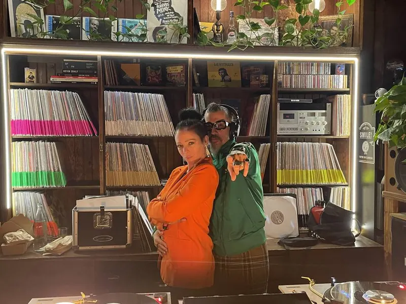 In front of the record wall